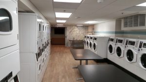 Laundry room full of machines. Meant for blog post covering how to set up a multi housing laundry room