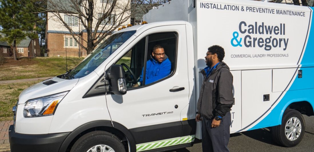 Caldwell & Gregory employees talking in a service van about a customer service request