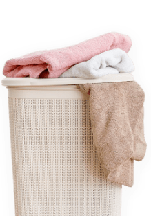 Laundry basket with transparent background. Three towels on top or hanging off the basket