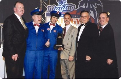 Maytag group posing with a recently won award