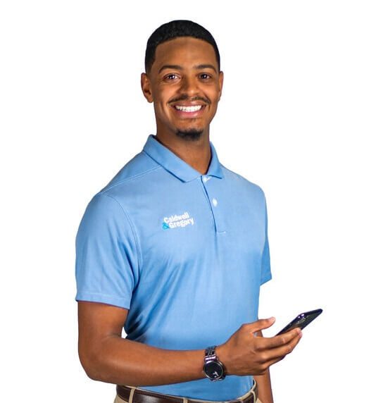 Caldwell & Gregory employee in a company polo holding a phone