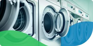 Benefits of upgrading commercial laundry equipment - picture shows commercial washers